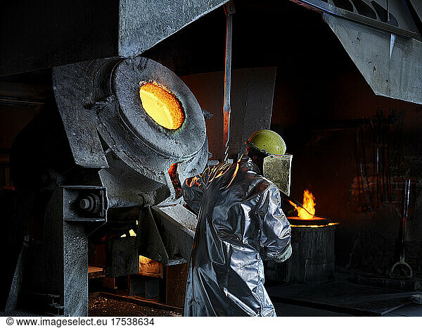 Blue-collar worker wearing protective workwear in steelmaking industry