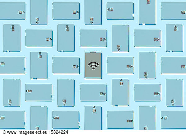 Blue contactless credit cards and smartphone with wifi sign on light blue background