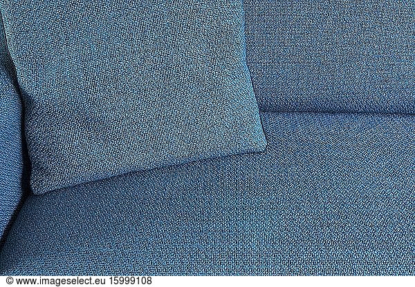 Blue Fabric textile close-up background texture with pillow  modern color interior.