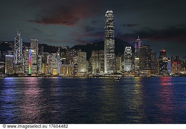 Blue hour view from Kowloon of the skyline on Hong Kong Island on the Hong Kong River  Central  with Bank of China on the far left and IFC Tower on the right  Hong Kong  China  Asia