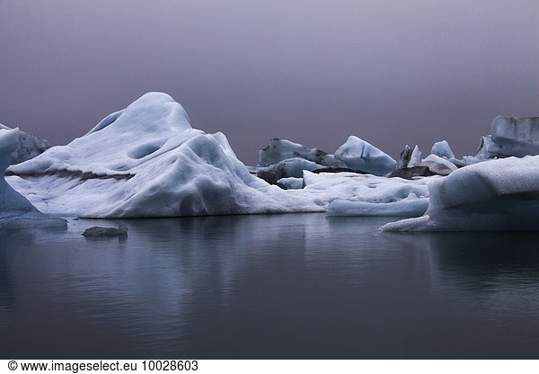 Blue icebergs in calm water  Jokulsarlon  Iceland