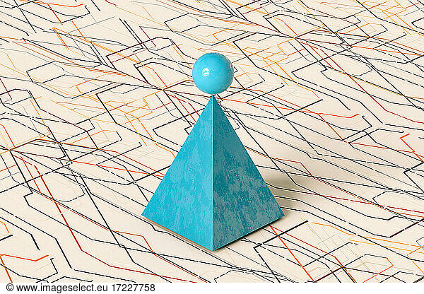 Blue pyramid and sphere on pattern