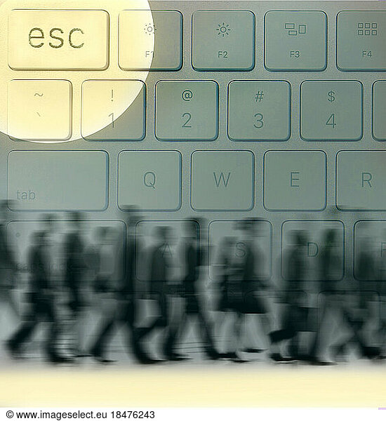 Blurred motion of group of people walking past keyboard with highlighted ESC key