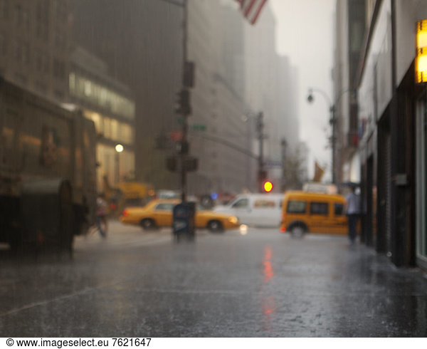 Blurred view of rainy city street