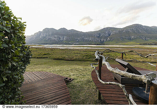 Boardwalk and open space on the shore of a lagoon