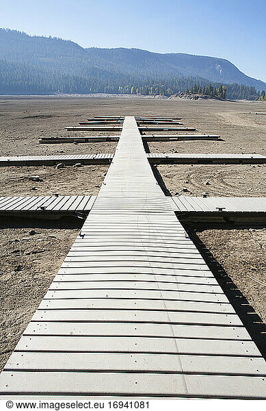 Boardwalk on a dry desert  wooden planks