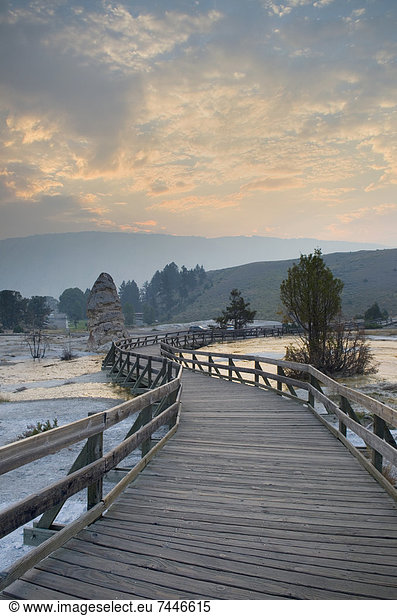 Boardwalk over the waters and landscape of the hot springs in Grassy Springs at Mammoth Hot Springs  Yellowstone National Park  in Wyoming
