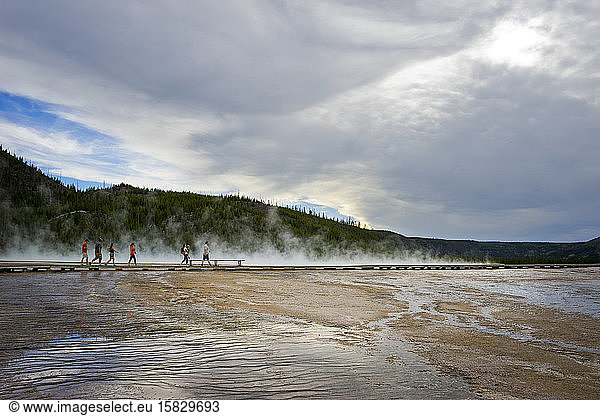 Boardwalk with people at Grand Prismatic Spring  Midway Geyser Basin