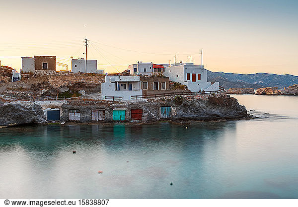 Boat houses in fishing village of Goupa on Kimolos island in Greece.