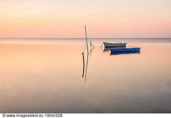 Boats at sunrise in Delta de Ebro Natural Park