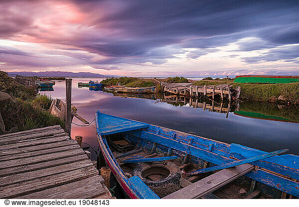 Boats at sunset within Delta de Ebro National Park