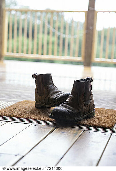Boots on doormat in cabin doorway
