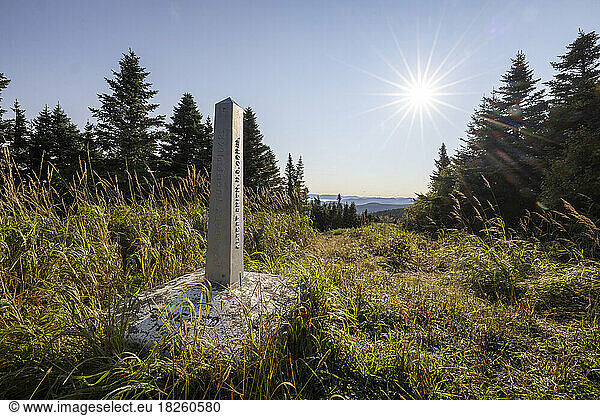 Border obelisk and along international boundary between USA and Canada