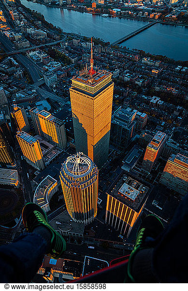 Boston aerial shot looking down at skyscrapers at sunrise.