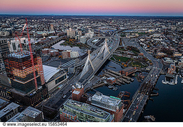 Boston aerial views above Zakim Bridge at sunrise.