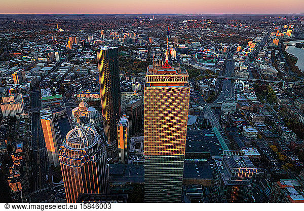 Boston aerial views from helicopter during peak foliage at sunrise.
