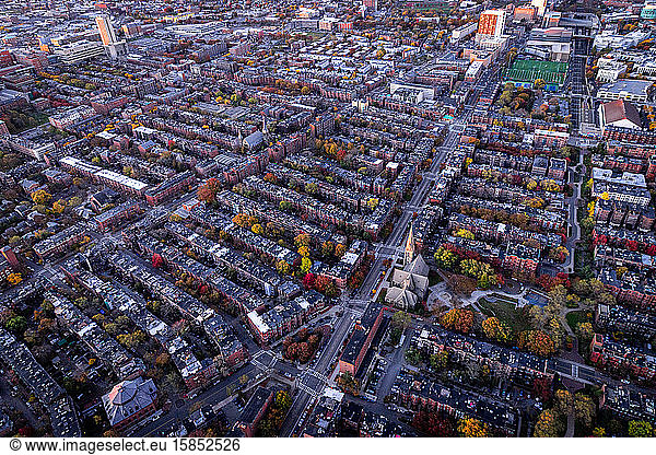Boston aerial views from helicopter during peak foliage at sunrise.