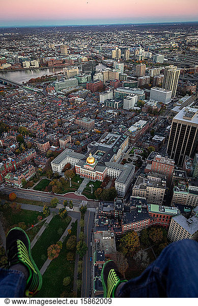 Boston aerial views of city buildings from helicopter at sunrise.