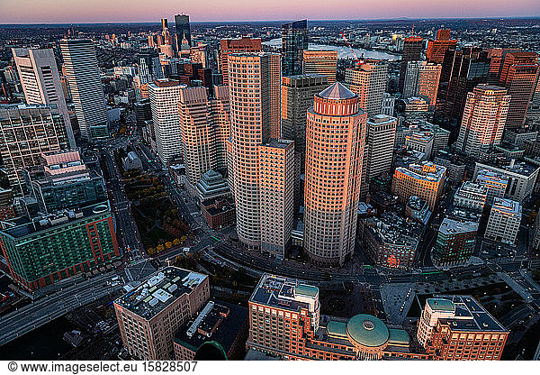Boston cityscape aerial view from helicopter at sunrise.