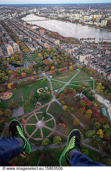 Boston helicopter aerial views of foliage in park during sunrise.