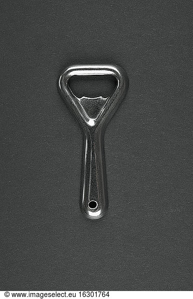 Bottle opener on grey background