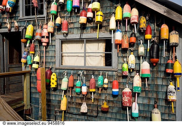 Bouys  lost and found hang on a fishing shack in Bernard  Maine.