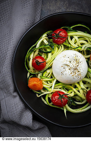 Bowl ofÂ zoodlesÂ with baked tomatoes andÂ burrataÂ cheese