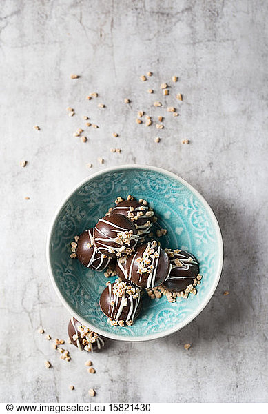 Bowl of chocolate pralines with hazelnut brittle