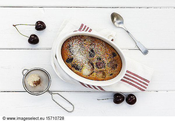 Bowl of gluten free homemade clafoutis with cherries  peaches and almonds
