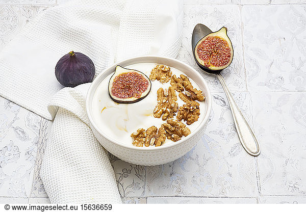 Bowl of Greek yogurt with honey  walnuts and fig