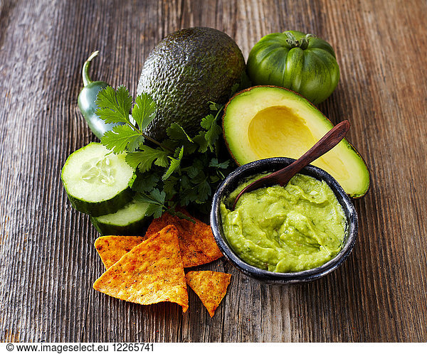 Bowl of Guacamole  ingredients and tortilla chips