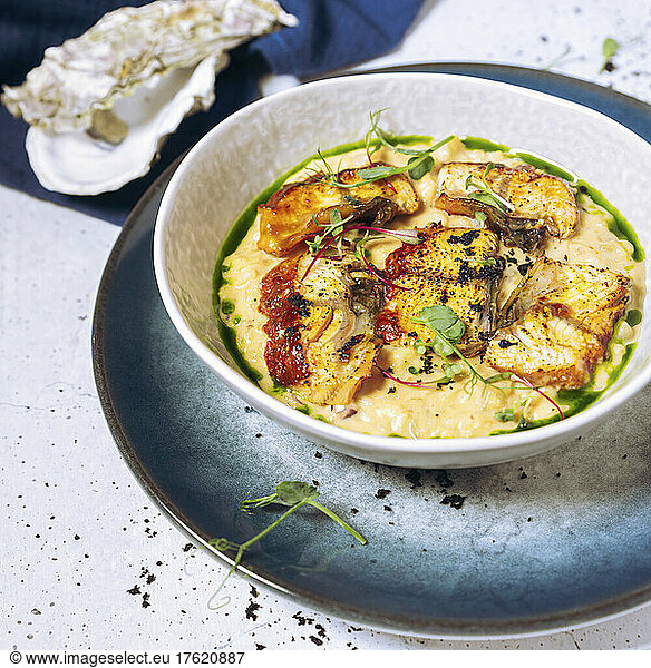 Bowl of risotto with eel and herbs
