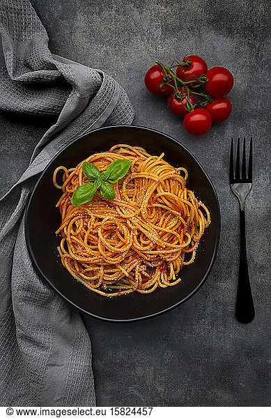 Bowl of spaghetti with basil and Parmesan