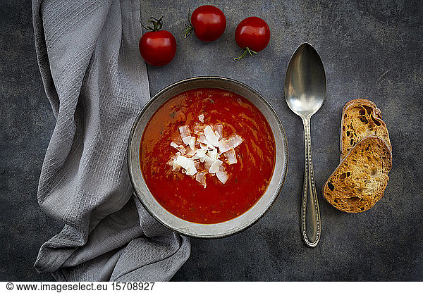 Bowl of vegan tomato soup with coconut flakes