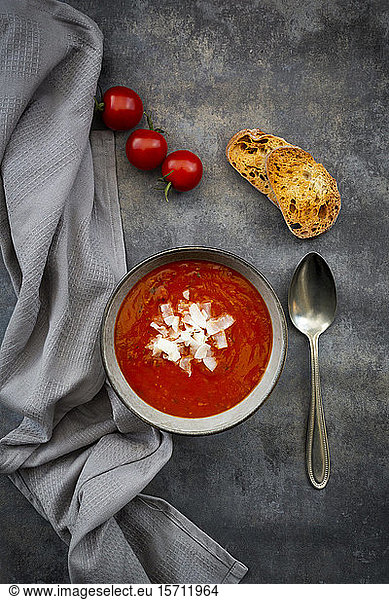 Bowl of vegan tomato soup with coconut flakes