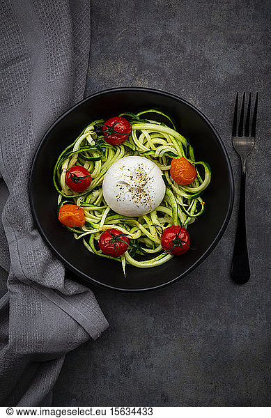 Bowl ofÂ zoodlesÂ with baked tomatoes andÂ burrataÂ cheese