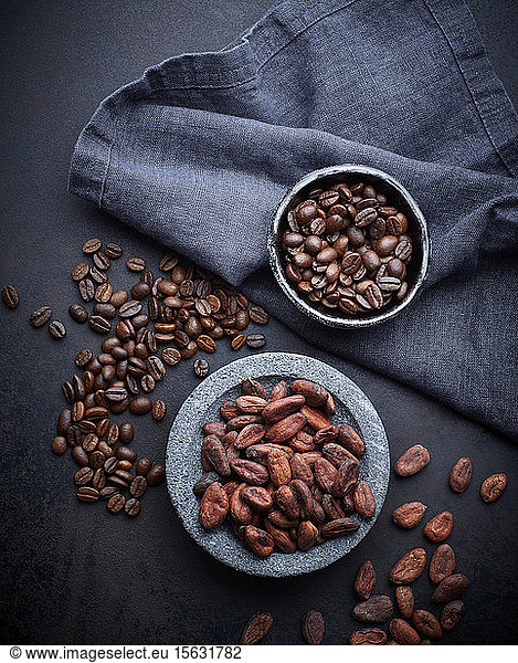 Bowls of cocoa and coffee beans