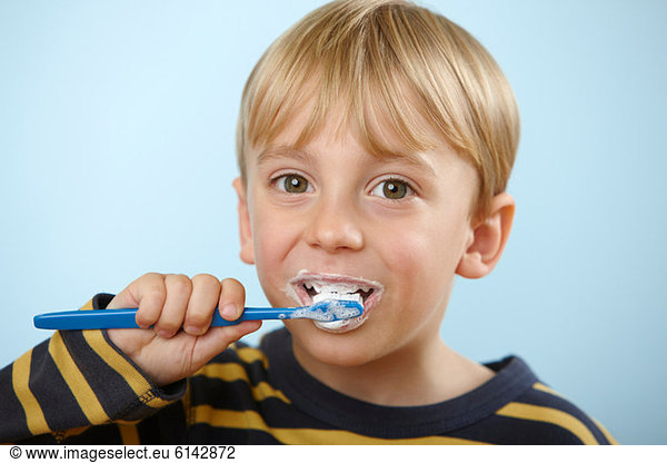 Boy brushing teeth