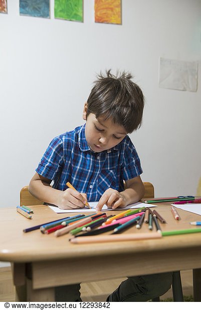 Boy colouring with coloured pencils Munich  Germany