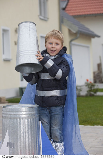 Boy constructing rocket