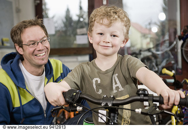 Boy getting a new children's bike