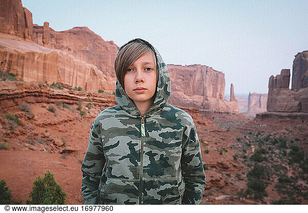 Boy in Camo at Park Avenue View Point at Arches National Park at Dawn
