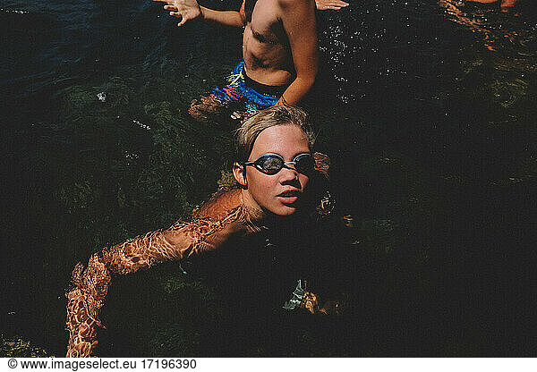 Boy in Goggles looks up from a California Swimming Hole.