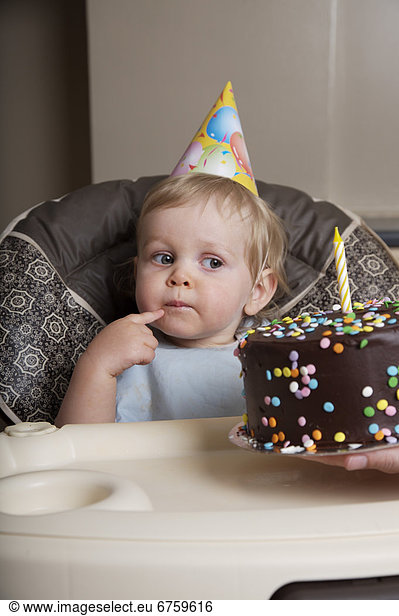 Boy Looking at Birthday Cake on 1st Birthday