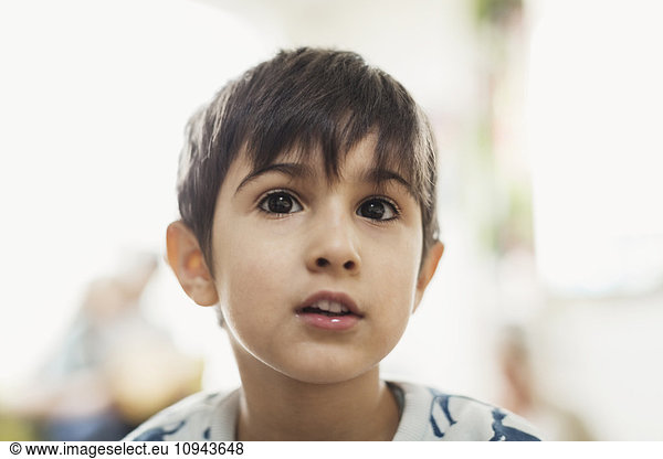 Boy looking away in day care center