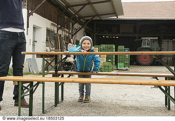 Boy playing around picnic table  Bavaria  Germany