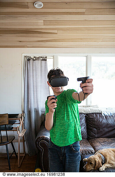 Boy playing video game on virtual reality system