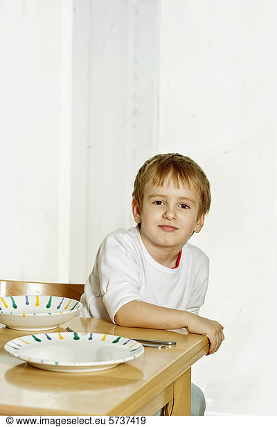 Boy sitting at the dinner table