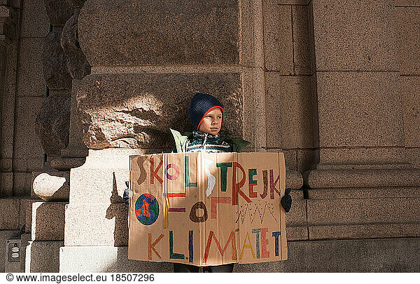 boy striking for climate change in Stockholm.