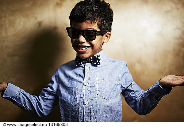 Boy wearing sunglasses and bow tie